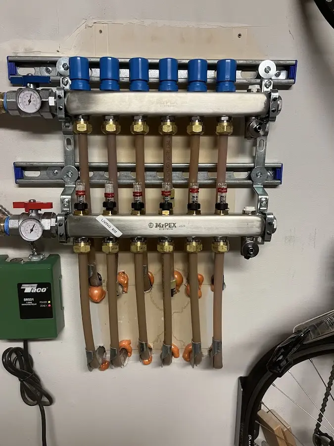 Plumber performing Water Heater Repair at a residential property in Grand Bay